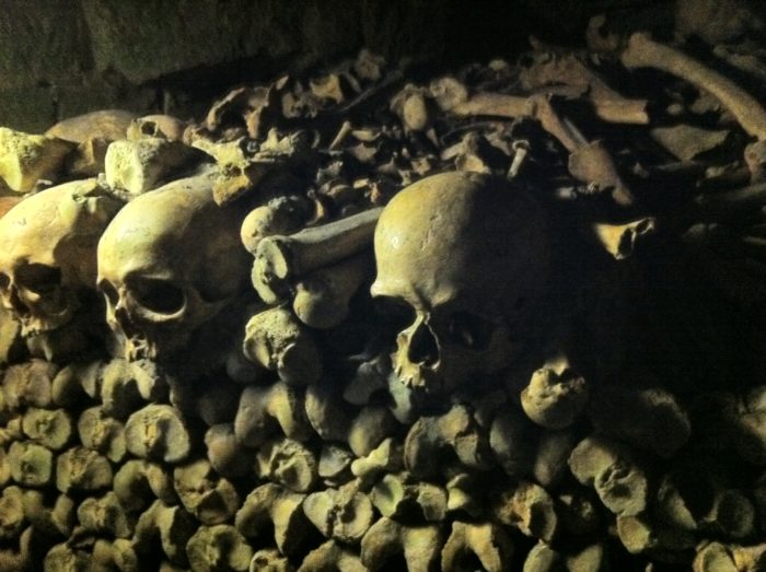 Skulls and bones are stacked creatively in the Parisian Catacombs. Photo credit: V. Laino