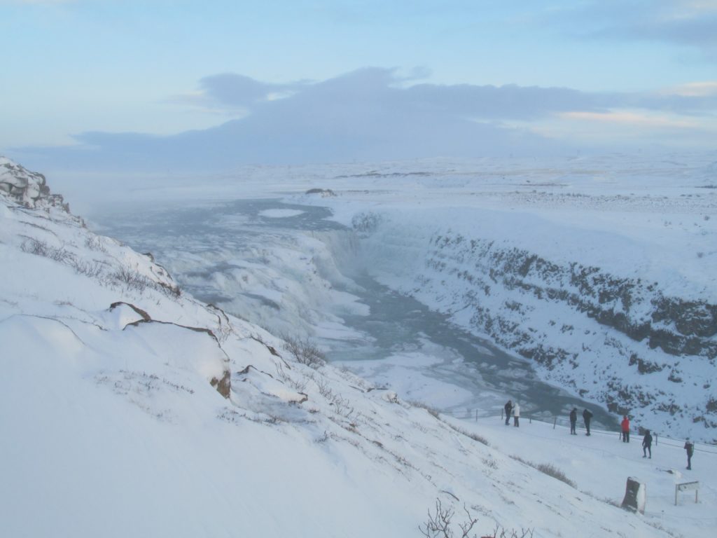 Don't let the weather deter you; dress appropriately when visiting Gullfoss waterfall in Iceland. Photo credit: M. Ciavardini