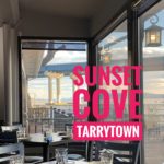 The words "Sunset Cove Tarrytown" superimposed over an image of the interior of the restaurant and its windows, through which the Governor Mario Cuomo Bridge and the Hudson River can be seen. Photo credit: M. Ciavardini.